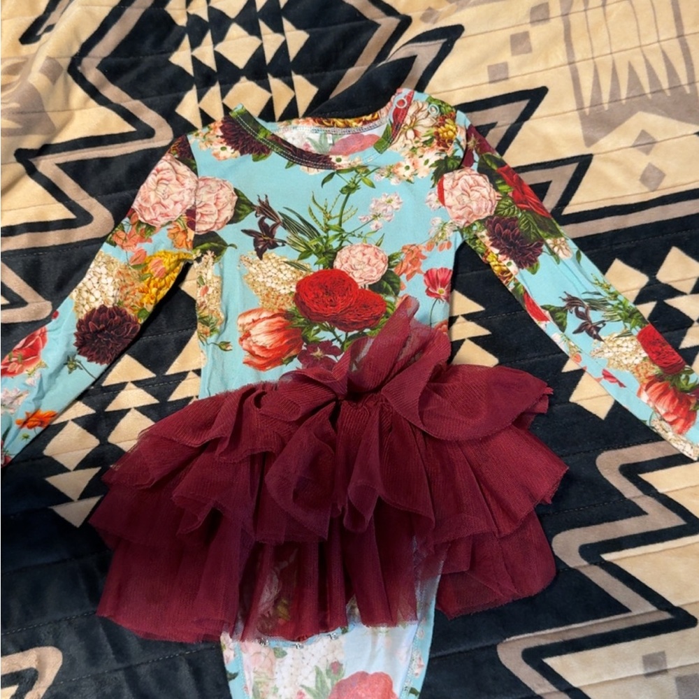 Posh peanut ruffle body suit